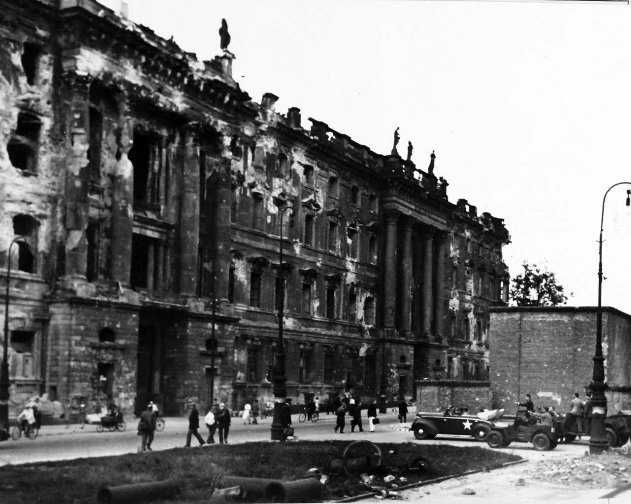 80-G-49991:  Potsdam Conference, 17 July – 2 August 1945. Berlin, Germany.  Note the bombed out building on the left.   The building maybe the Berliner Schloss or the Berlin city palace, residence of the Kasiers prior to abdication in 1919.   Photographed by CPhoM William Belknap, Jr. and received July 16, 1945. U.S. Navy Photograph, now in the collections of the National Archives.  (2016/02/23).