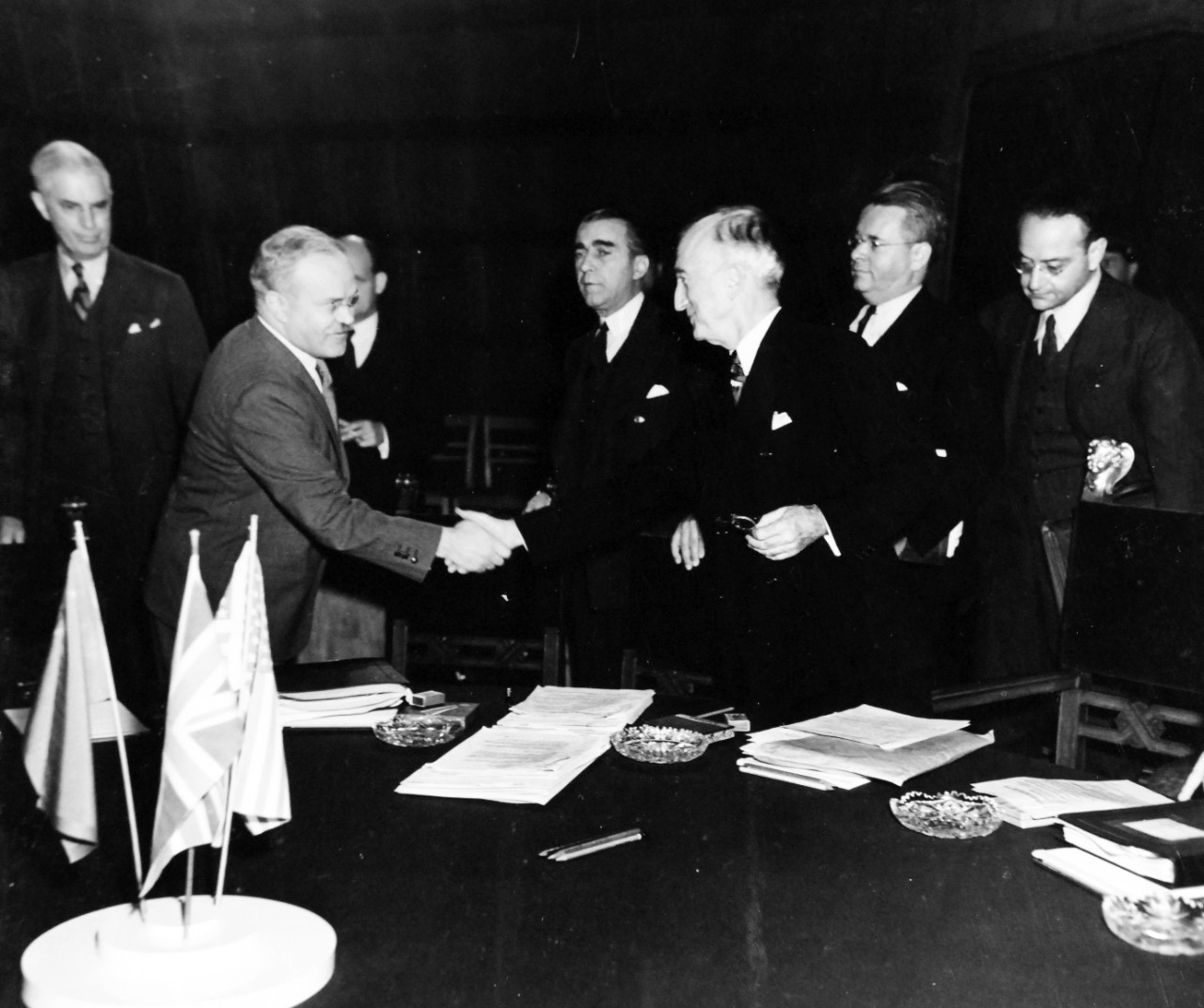 80-G-700119: Potsdam Conference, July-August 1945. The “Little Three” (Foreign Ministers) meeting in the same conference room as the Heads of States at Potsdam, Germany.  Foreign Commissar V. Molotov being greeted by Secretary of State James F. Byrnes prior to opening.  Photographed released July 24, 1945.  Official U.S. Navy Photograph, now in the collections of the National Archives.  (2016/02/23).