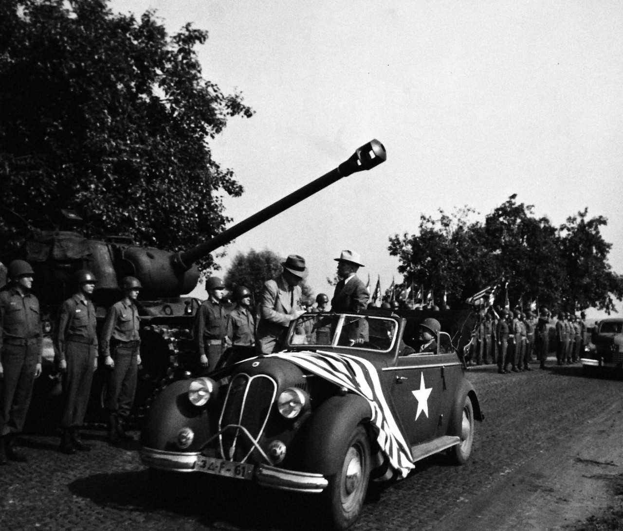 80-G-700170: Potsdam Conference, July-August 1945.  President Harry S. Truman and party inspecting troops of 3rd Armored Division just south of Frankfurt, Germany.  Photographed by CPhoM William Belknap Jr., released July 26, 1945.   Official U.S. Navy Photograph, now in the collections of the National Archives.  (2016/02/23).