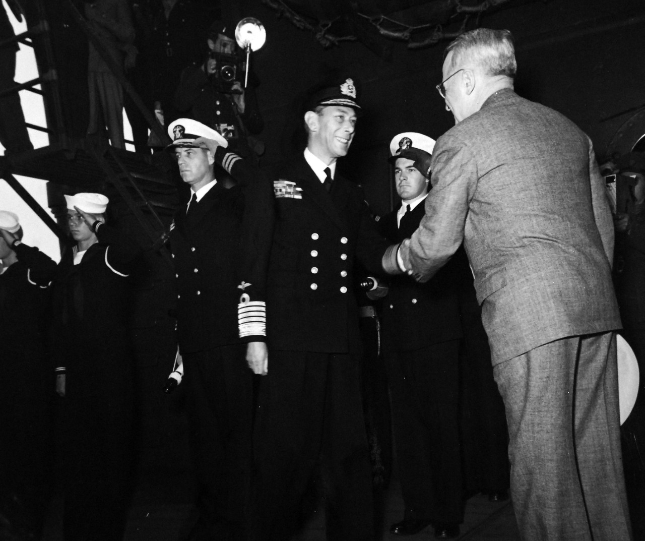 80-G-700227:  Potsdam Conference, July-August 1945. King George VI aboard USS Augusta (CA-31) for a return visit to President Harry S. Truman while the ship is in Plymouth Harbor, England.  President Harry S. Truman welcomes the king aboard.  Photograph released August 1945.  Official U.S. Navy Photograph, now in the collections of the National Archives.  (2016/02/23).
