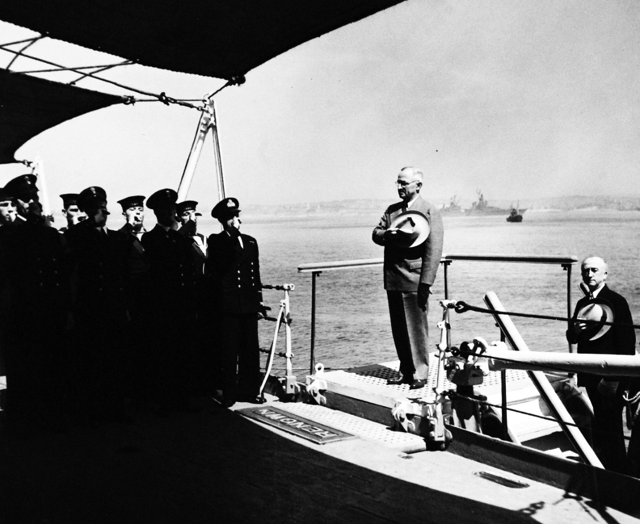 80-G-700236:  Potsdam Conference, July-August 1945.  President Harry S. Truman pays call on King George onboard his ship, HMS Renown in Plymouth Harbor, England.  President Truman receives side honors.  Behind him is Secretary of State James F. Byrnes.  Photograph released August 2, 1945.  Official U.S. Navy Photograph, now in the collections of the National Archives.  (2016/02/23).