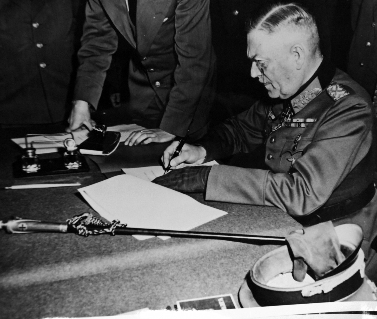 111-SC-27429:   Surrender of Germany, May 9, 1945.  Field Marshall Wilheim Keitel, signing the ratified surrender terms for the Germany Army at Russian Headquarters in Berlin. U.S. Army photograph.  Courtesy of the Library of Congress Collection, Lot-8988. (2015/10/16).