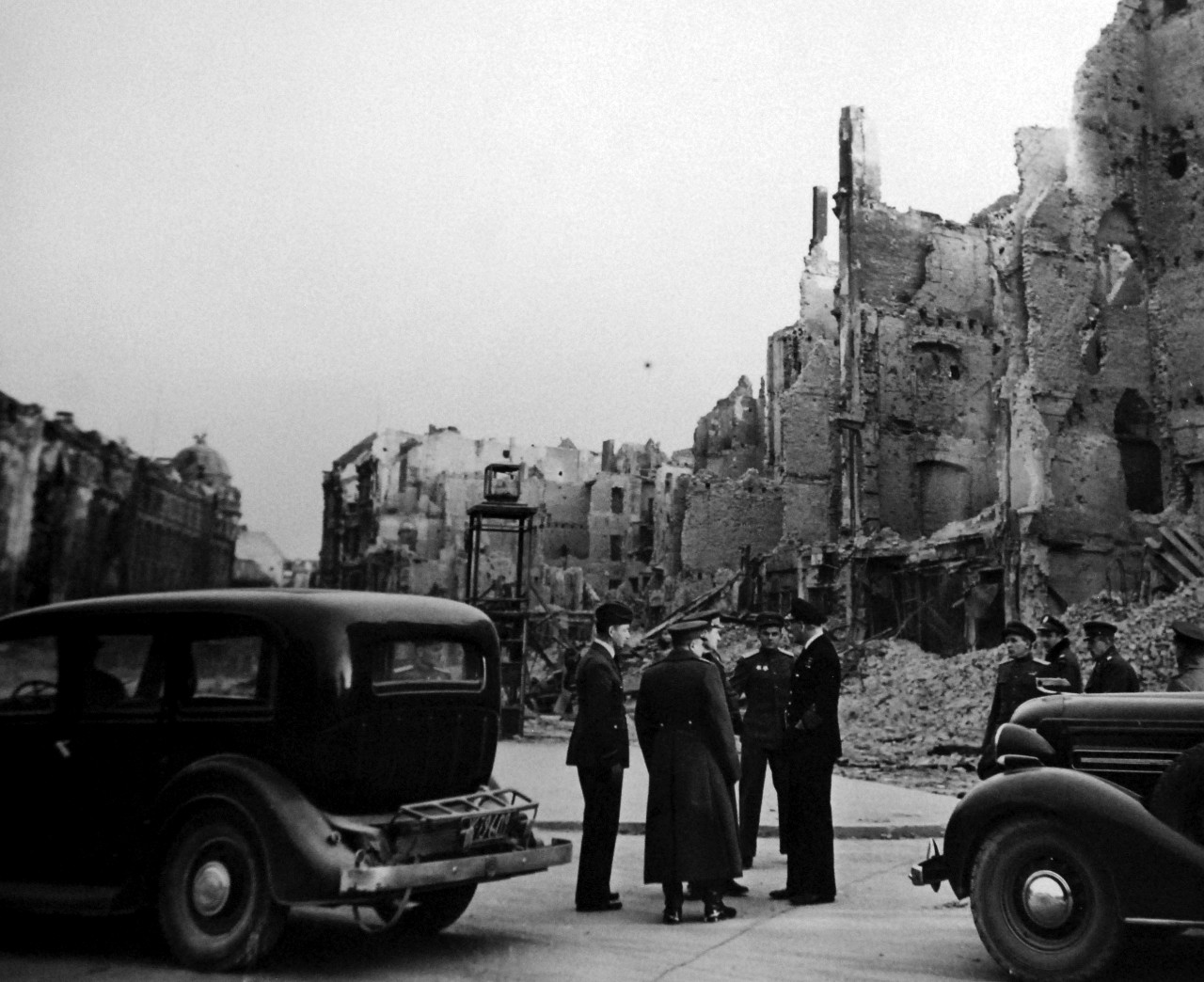 111-SC-27438:   Surrender of Germany, May 9, 1945.  Air Chief Marshall Sir Arthur Teddar, Deputy Supreme Commander and Admiral Sir Harold M. Burroughs, Allied Naval Commander in Chief, are shown around demolished Berlin, Germany, by their Russian hosts.  Supreme Headquarters Allied Expeditionary Force (SHAEF) Officials are there to sign the ratified surrender terms agreed upon at Reims.   Photographed by Lieutenant Moore.   U.S. Army photograph.  Courtesy of the Library of Congress Collection, Lot-8988. (2015/10/16).
