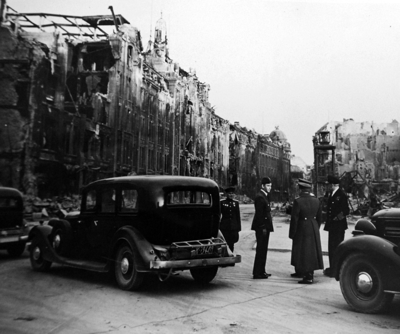 111-SC-27439:   Surrender of Germany, May 9, 1945.  Air Chief Marshall Sir Arthur Teddar, Deputy Supreme Commander and Admiral Sir Harold M. Burroughs, Allied Naval Commander in Chief, are shown around demolished Berlin, Germany, by their Russian hosts.  Supreme Headquarters Allied Expeditionary Force (SHAEF) Officials are there to sign the ratified surrender terms agreed upon at Reims.   Photographed by Lieutenant Moore.   U.S. Army photograph.  Courtesy of the Library of Congress Collection, Lot-8988. (2015/10/16).