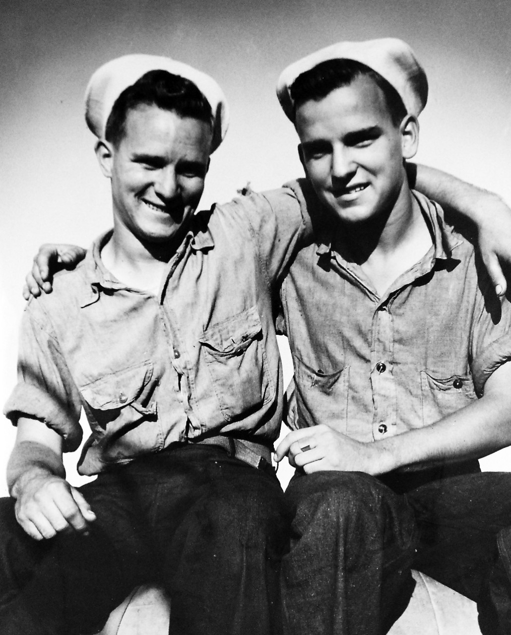 26-G-1987:   Operation Avalanche, September 1943.  Brothers Meet in Italy.  These two brothers met for the first time since they enlisted when they both participated in the Invasion of Salerno, Italy.  They are Coast Guardsmen Joseph H. Blue, (left) and Aloysius Blue, of Washington, D.C.   The Coast Guardsman is serving aboard a combat transport and his brother is a member of a Navy beach party.     Official Coast Guard Photograph.  Photographed through Mylar sleeve.   Courtesy of the Library of Congress.  (2016/05/19). 