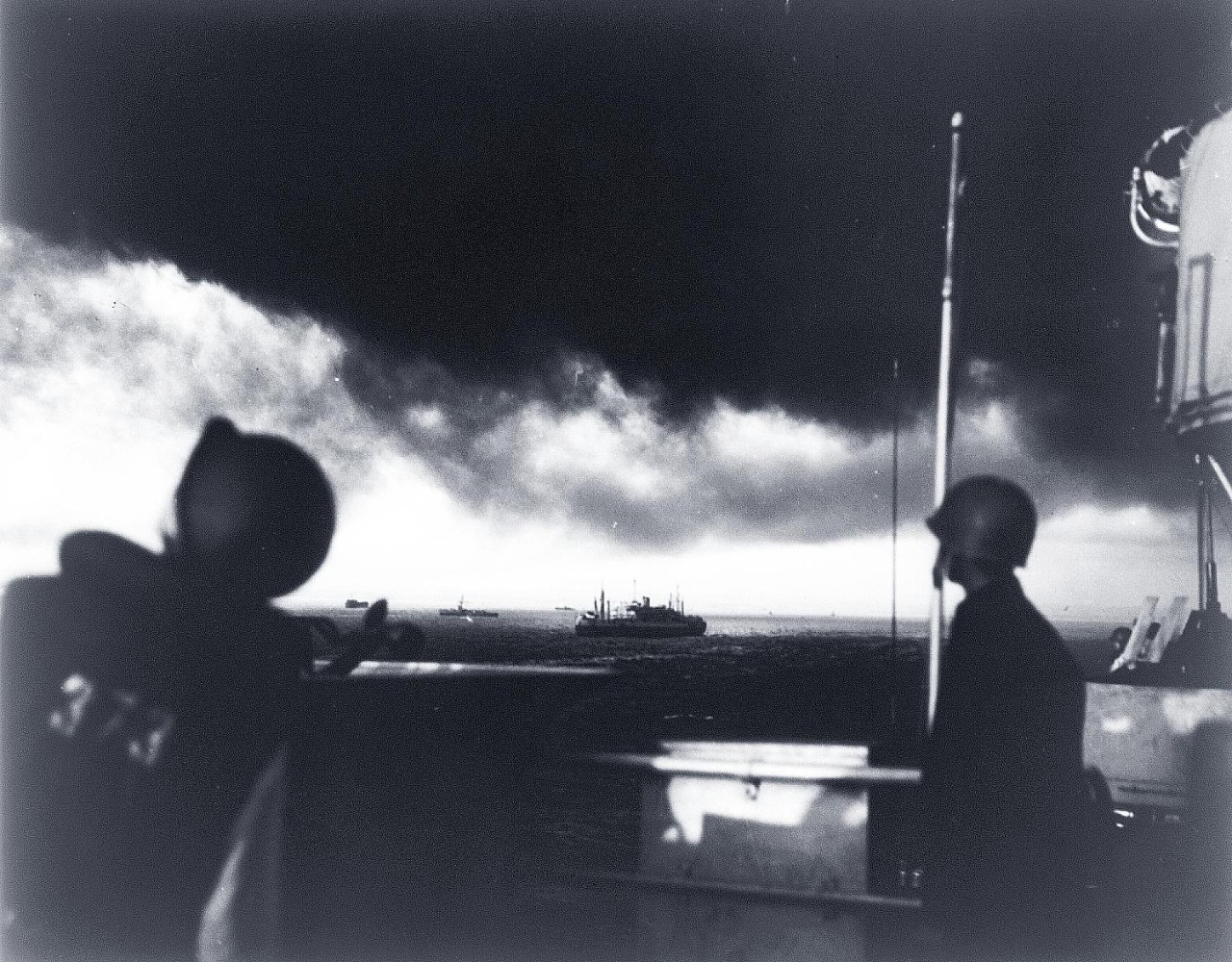 LC-USZ62-80645:   Operation Husky, July-August 1943.  U.S. Coast Guard gunners tensely study the lowering skies for enemy planes as the Coast Guard-manned transport nears Sicily.  Other ships in the invasion armada can be seen off side, July 1943.  U.S. Coast Guard Photograph. Courtesy of the Library of Congress.  (2015/11/13).