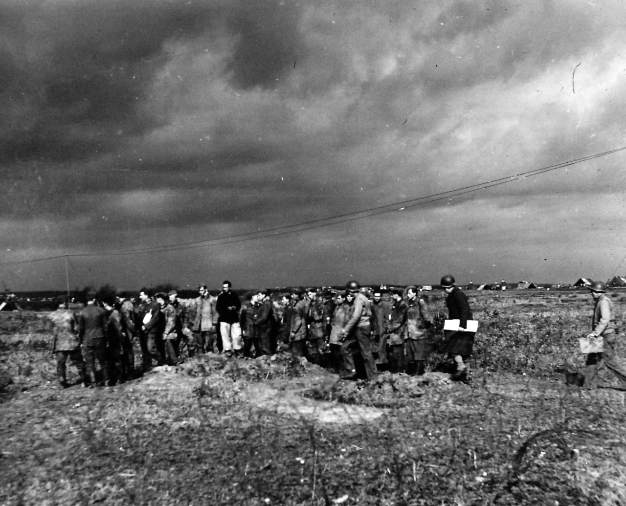 80-G-54403:     Battle of Anzio, January-June 1944.   German Prisoners seized by the 5th Army after the landing below Rome.  Most of the German garrison protecting this part of the Italian coast had been withdrawn.  German soldiers are shown.   Photograph released February 3, 1944.  Official  U.S. Navy photograph, now in the collections of the National Archives.  (2016/06/28).