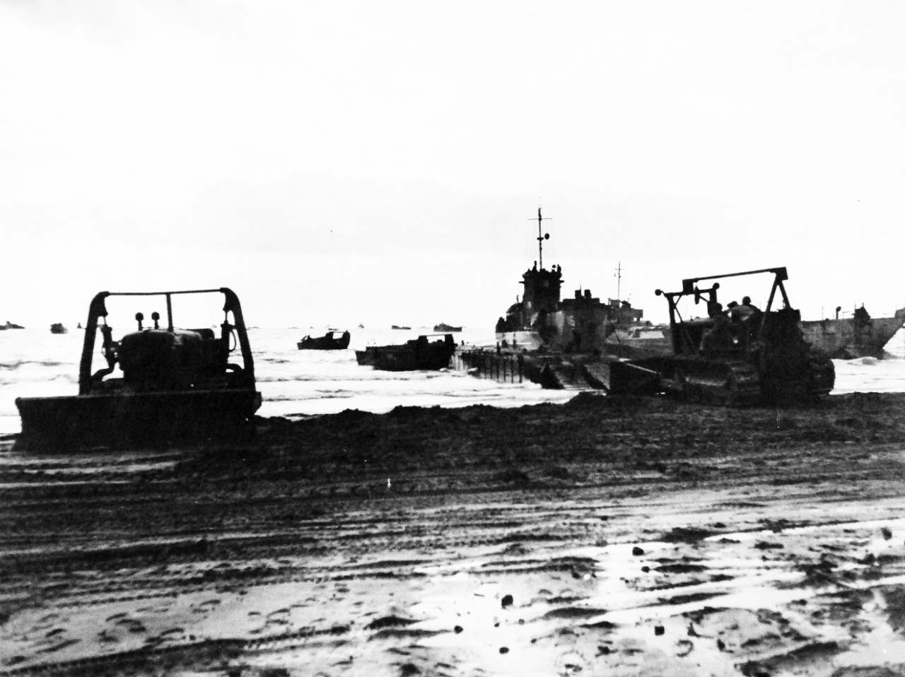 80-G-54406:   Battle of Anzio, January-June 1944.     Pontoon causeway set up in the Anzio-Nettuno area, Italy, to debark the 5th Army troops from an LCI during the first landing operations which were practically unopposed.  Only small-arms fire met the invasion force.   Photograph released February 3, 1944.  U.S. Navy photograph, now in the collections of the National Archives.  (2016/06/28).