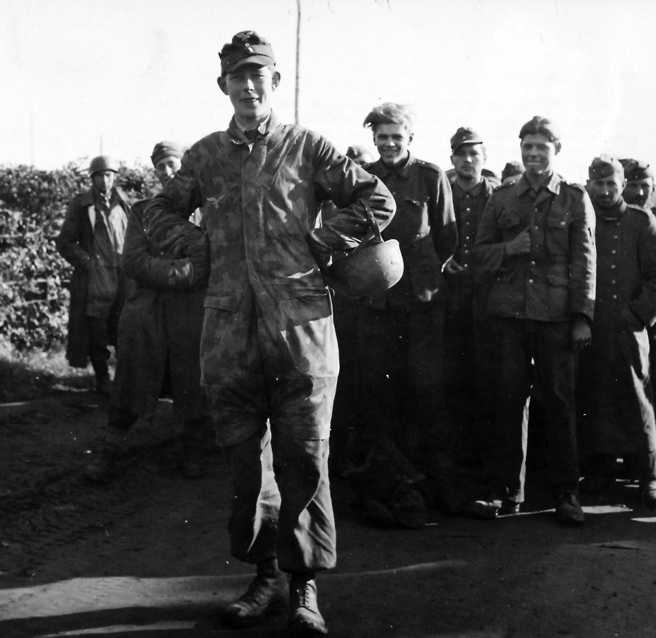 80-G-58427:  Battle of Anzio, January-June 1944.    German prisoners at Anzio, Italy.  A Lieutenant in Nazi paratrooper forces steps out to pose.  These prisoners were captured during the battle for the beachhead at Anzio.     Photographed March 3 1944.  Official U.S. Navy photograph, now in the collections of the National Archives.  (2016/06/28).