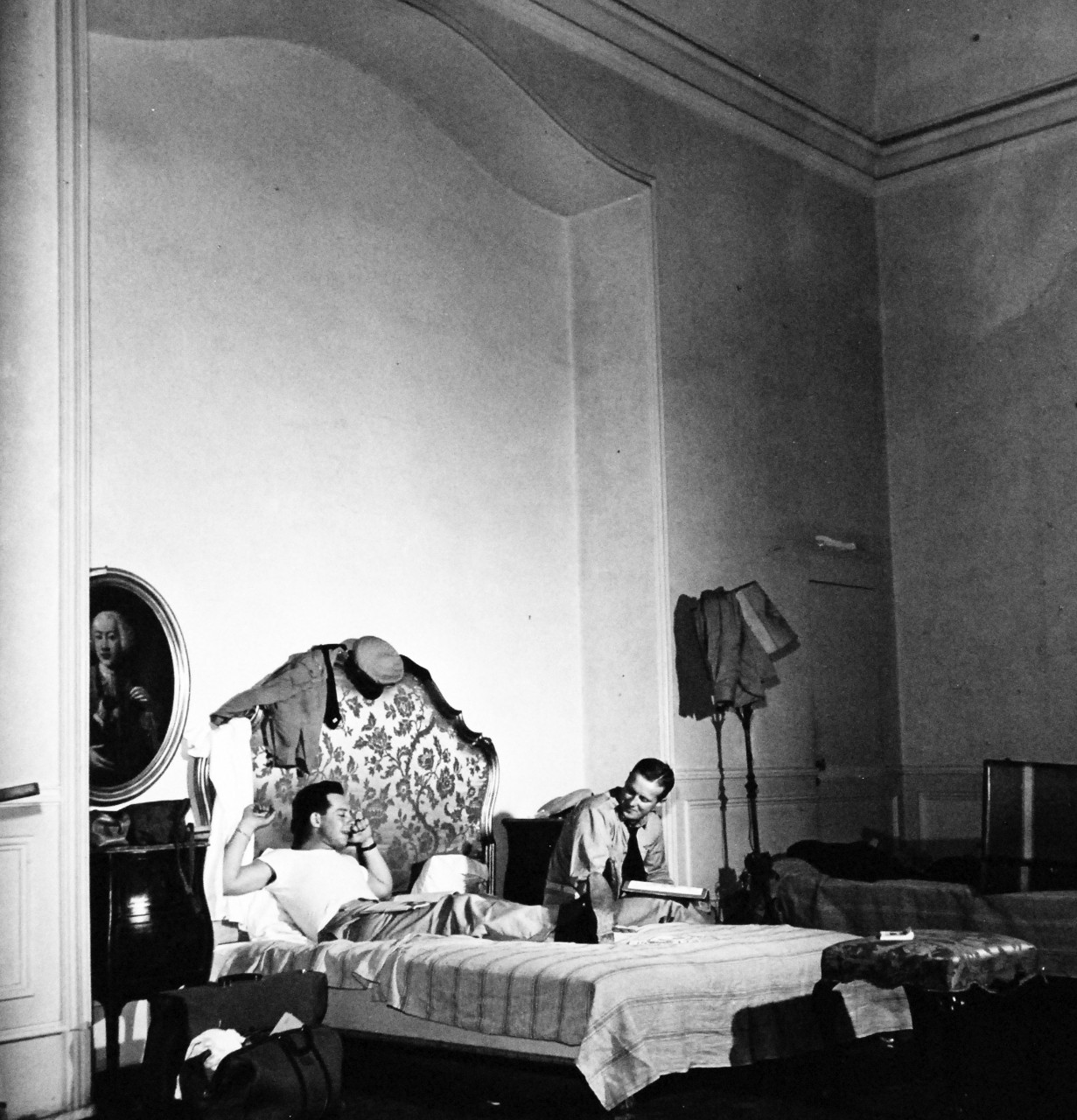 80-G-474118:  Naples, Italy, August 1944.    Ensign K. Dimin, (left), and Lieutenant Fritz Plumer, relax in former Royal Palace at Naples, Italy.  Steichen Photograph Unit:    Photographed by Lieutenant Wayne Miller, August 1944.   TR-11092.   Official U.S. Navy Photograph, now in the collections of the National Archives. (2015/12/08).