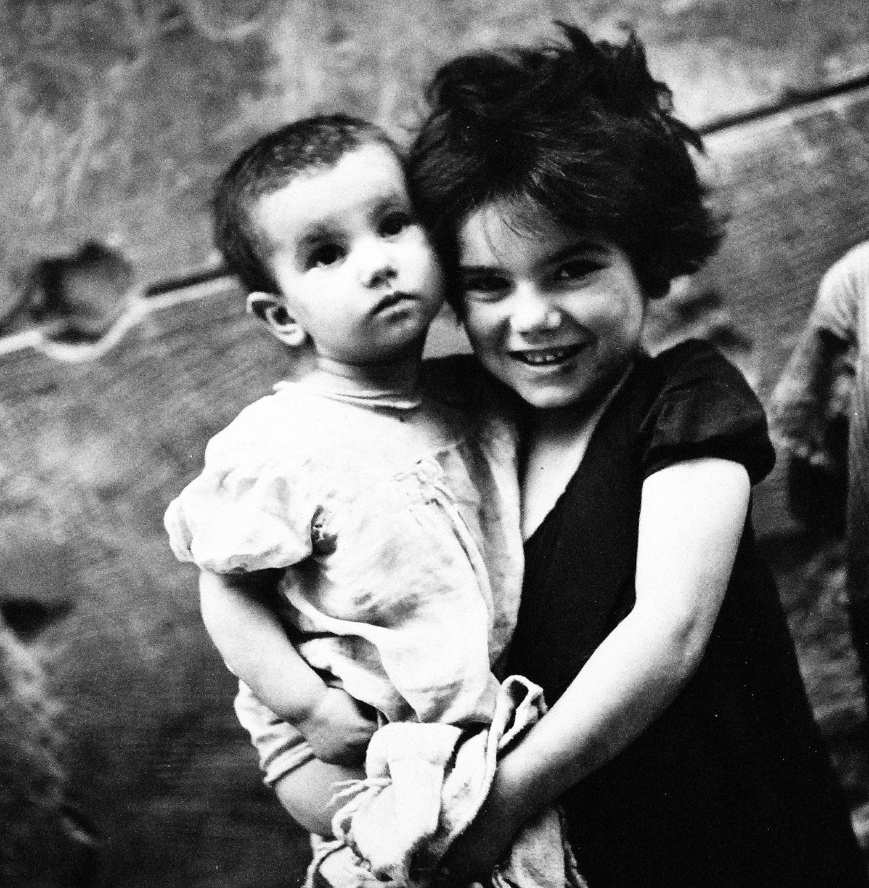 80-G-474130:  Naples, Italy, August 1944.   Children in Naples, Italy.   Little girl holds her apparently blind baby brother.  Steichen Photograph Unit:   Photographed by Lieutenant Wayne Miller, August 1944.  TR-11308.   Official U.S. Navy Photograph, now in the collections of the National Archives. (2015/12/08). 