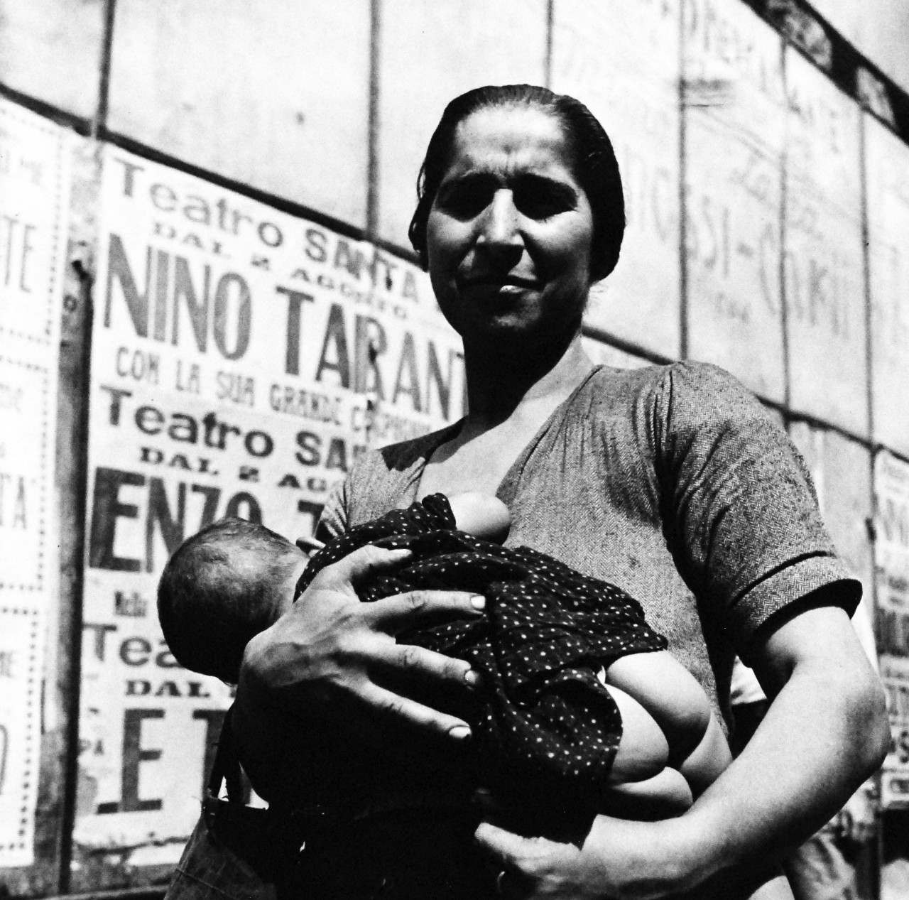 80-G-474151:  Naples, Italy, August 1944.    Older woman holds baby. Steichen Photograph Unit:  Photographed by Lieutenant Wayne Miller, August 1944.  TR-13038.   Official  U.S. Navy Photograph, now in the collections of the National Archives. (2015/12/08). 