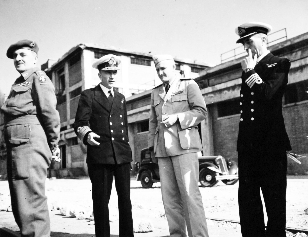 80-G-57185:  Naples, Italy, November 1943.    American and British Officers Tour Naples.   Left to right:  Lieutenant General Sir Humphery Gale; Admiral John Cunningham, RN; Commander W.A. Sullivan, USN; Captain W.A. Donst, RN.   November 9, 1943.   Official U.S. Navy Photograph, now in the collections of the National Archives.  (2017/05/02).