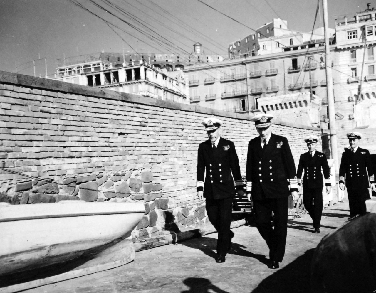 80-G-57186:  Naples, Italy, November 1943.  American and British Officers Tour Naples.    Rear Admiral J.A.N Morse, RN, and Admiral John Cunningham, RN, walk up to automobile after arrival, November 9, 1943.   Official U.S. Navy Photograph, now in the collections of the National Archives.  (2017/05/02).