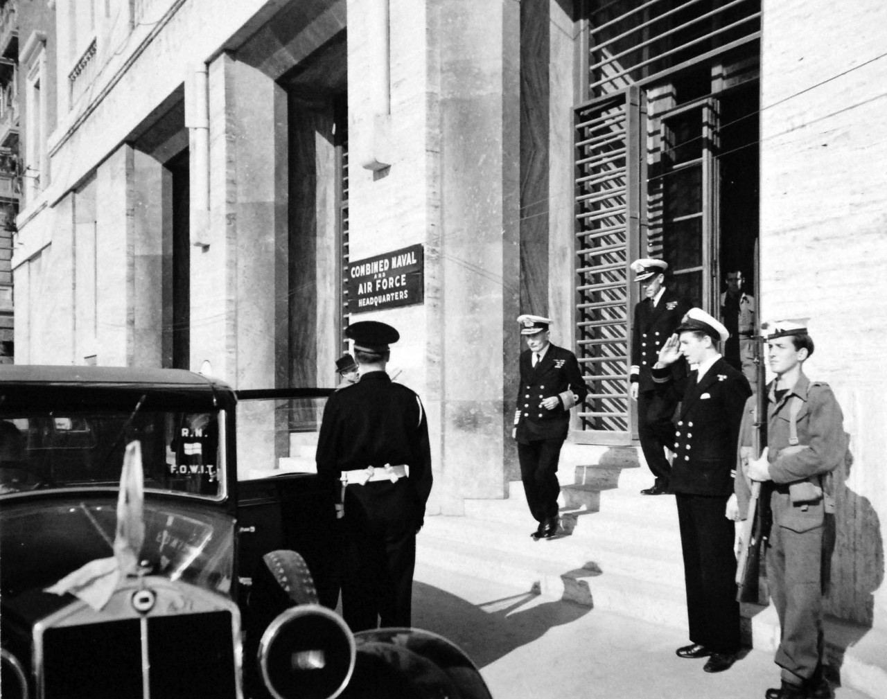 80-G-57187:  Naples, Italy, November 1943.  American and British Officers Tour Naples.   British Admiral John Cunningham, RN, leaving Navy House in Naples to start tour of the city, November 9, 1943.   U.S. Navy Photograph, now in the collections of the National Archives.  (2017/05/02).