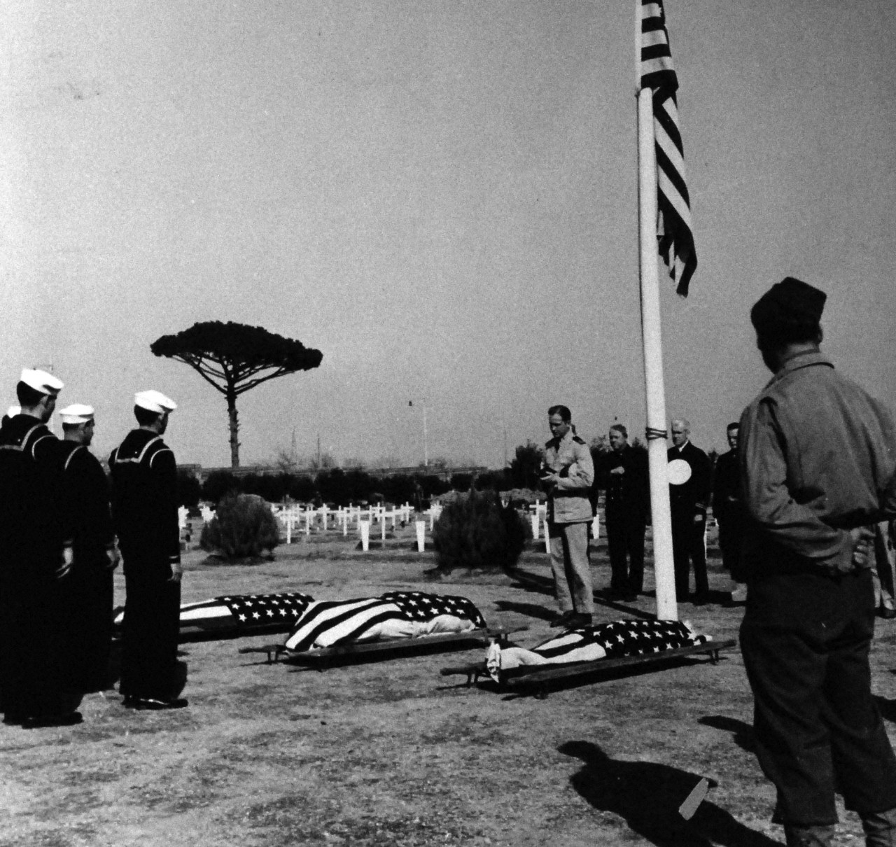 80-G-59369:   Battle of Anzio, January-June 1944.   Funeral services held in a military cemetery at Naples, Italy, for Machinist’s Mate Third Class Miles Beck; Seaman First Class James C. Jones, and Storekeeper Wilber K. Webb.   Photograph released on April 4, 1944.    Official U.S. Navy Photograph, now in the collections of the National Archives.   (2014/03/12). .  