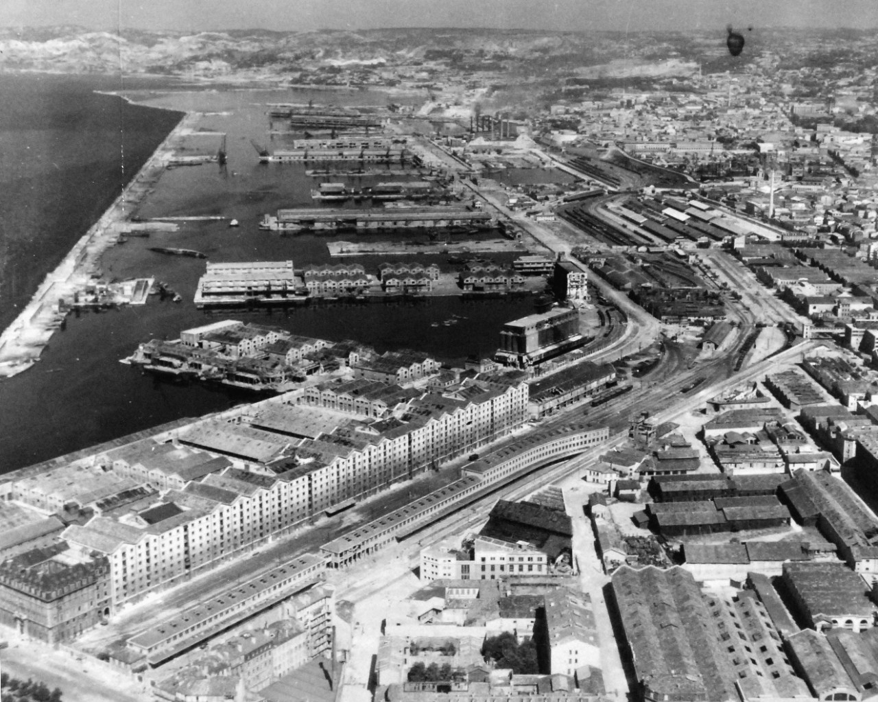 80-G-364052:  Invasion of Southern France, Marseille, August 1944.   Aerial view of the destruction to the harbor and installations at Marseille, France.  Taken by crew of USS Catoctin (AGC-5).  Photograph received on 2 April 1946.   Official U.S. Navy Photograph, now in the collections of the National Archives.  (2014/7/10).