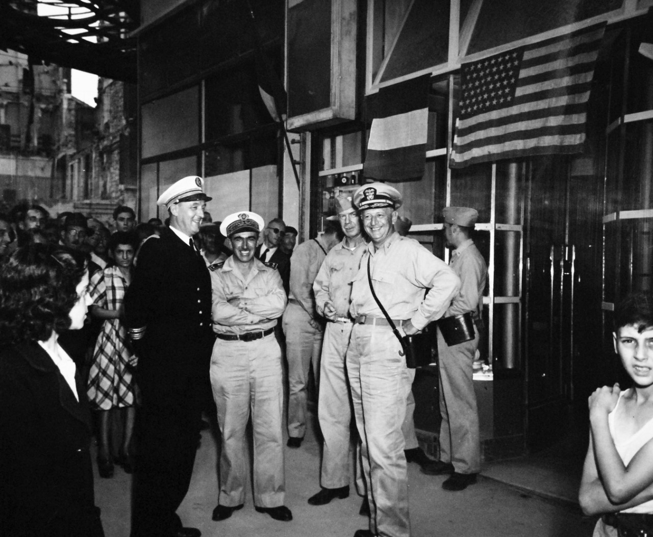 80-G-364090:   Invasion of Southern France, Marseille, August 1944.   Vice Admiral H. Kent Hewitt, USN, visits U.S. Navy Headquarters in Marseille, France.  Shown, left to right:   Captain Sticca; Rear Admiral A. Lemonnier, Commander Leonard Doughty, USN, and Vice Admiral H. Kent Hewitt, 3 September 1944.  Taken by crew of USS Catoctin (AGC-5).    Official U.S. Navy Photograph, now in the collections of the National Archives.  (2014/7/10).