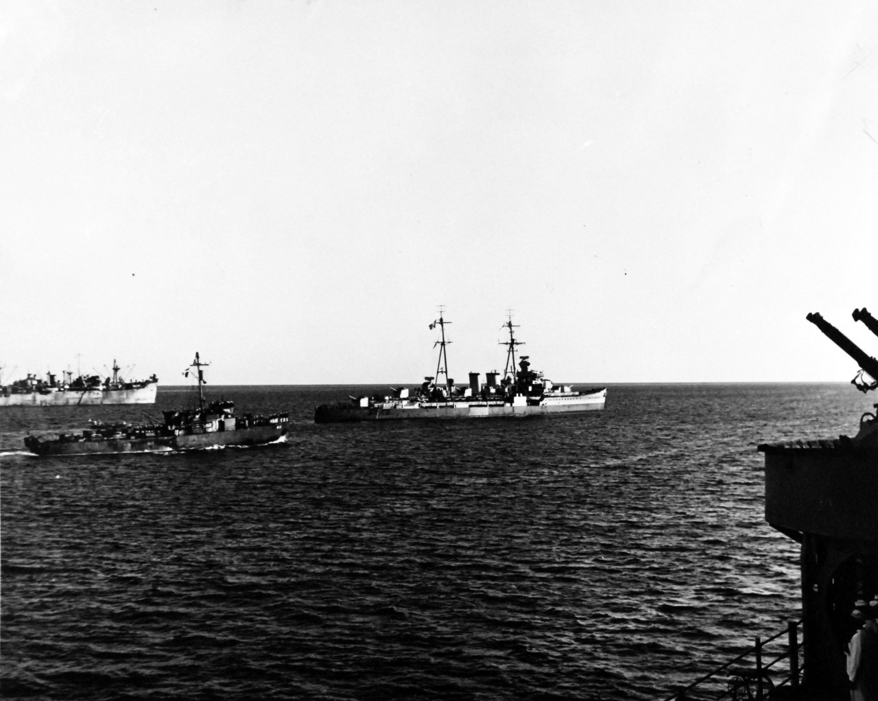 80-G-248717:   Invasion of Southern France, Toulon,  September 1944.   General C. DeGaulle in small ship approaching HMS Sirius, 16 September 1944.    Cruiser in center is HMS Delhi. Taken by USS Philadelphia (CL-41).  Official U.S. Navy Photograph, now in the collection of the National Archives.  (2014/4/10). 