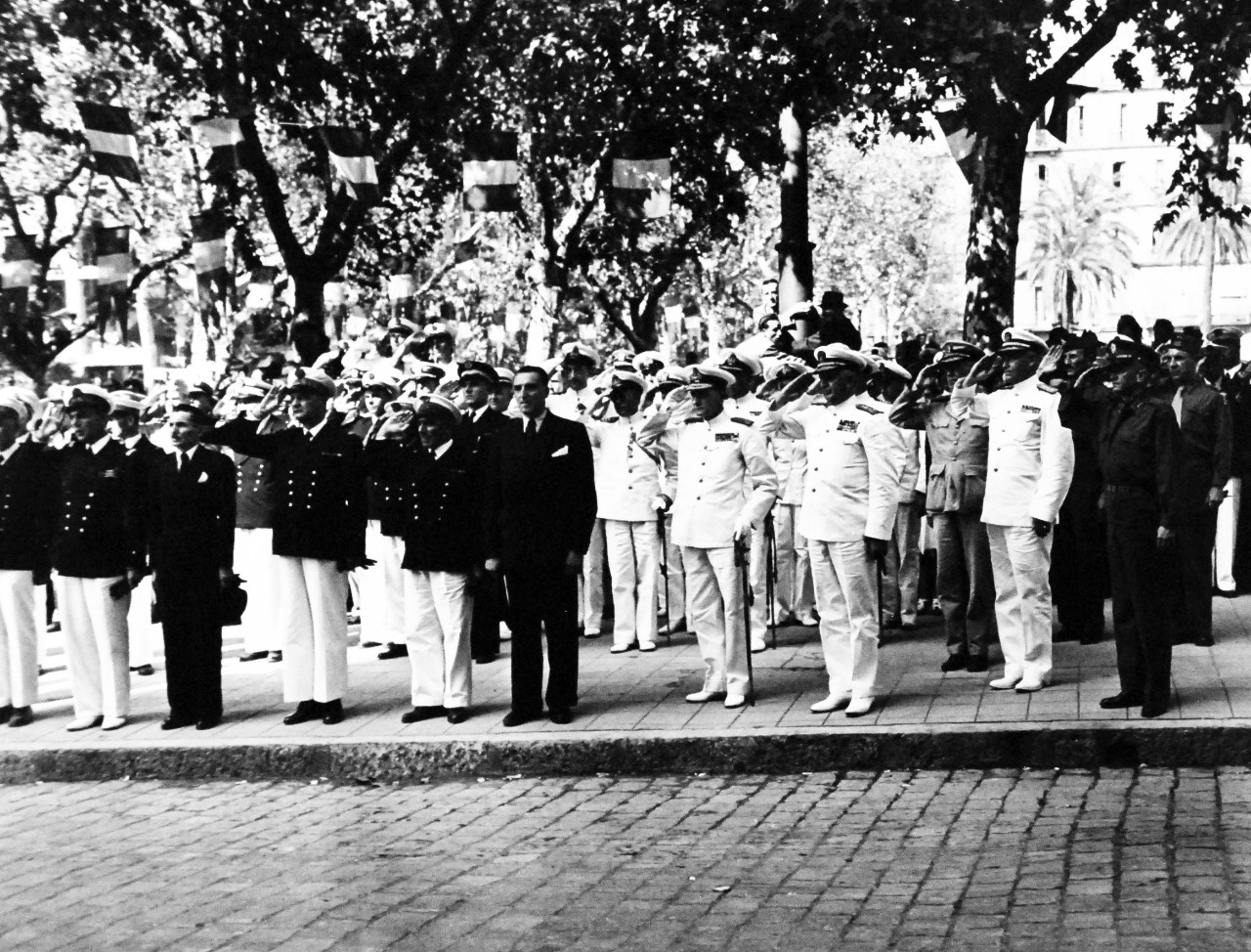 80-G-248724:   Invasion of Southern France, Toulon,  September 1944.   Ceremonies in Toulon celebrating the liberation of France.  Taken by USS Philadelphia (CL-41), 14 September 1944.   Shown (left to right):  Admiral Jaujard; Admiral Auboyneau; Navy Minister Jaquinot; Admiral Lambert, Commander in Chief, French Naval Forces; Admiral Lemonier; M. Arnal, Mayor of Toulon; Sir John Cunningham, Commander in Chief, Royal Navy; Vice Admiral Kent H. Hewitt; Rear Admiral L.A. Davidson; Major General A. Wilson, USA, during parade on De Strasbourg Boulevard, Toulon.  Official U.S. Navy Photograph, now in the collection of the National Archives.  (2014/4/10). 
