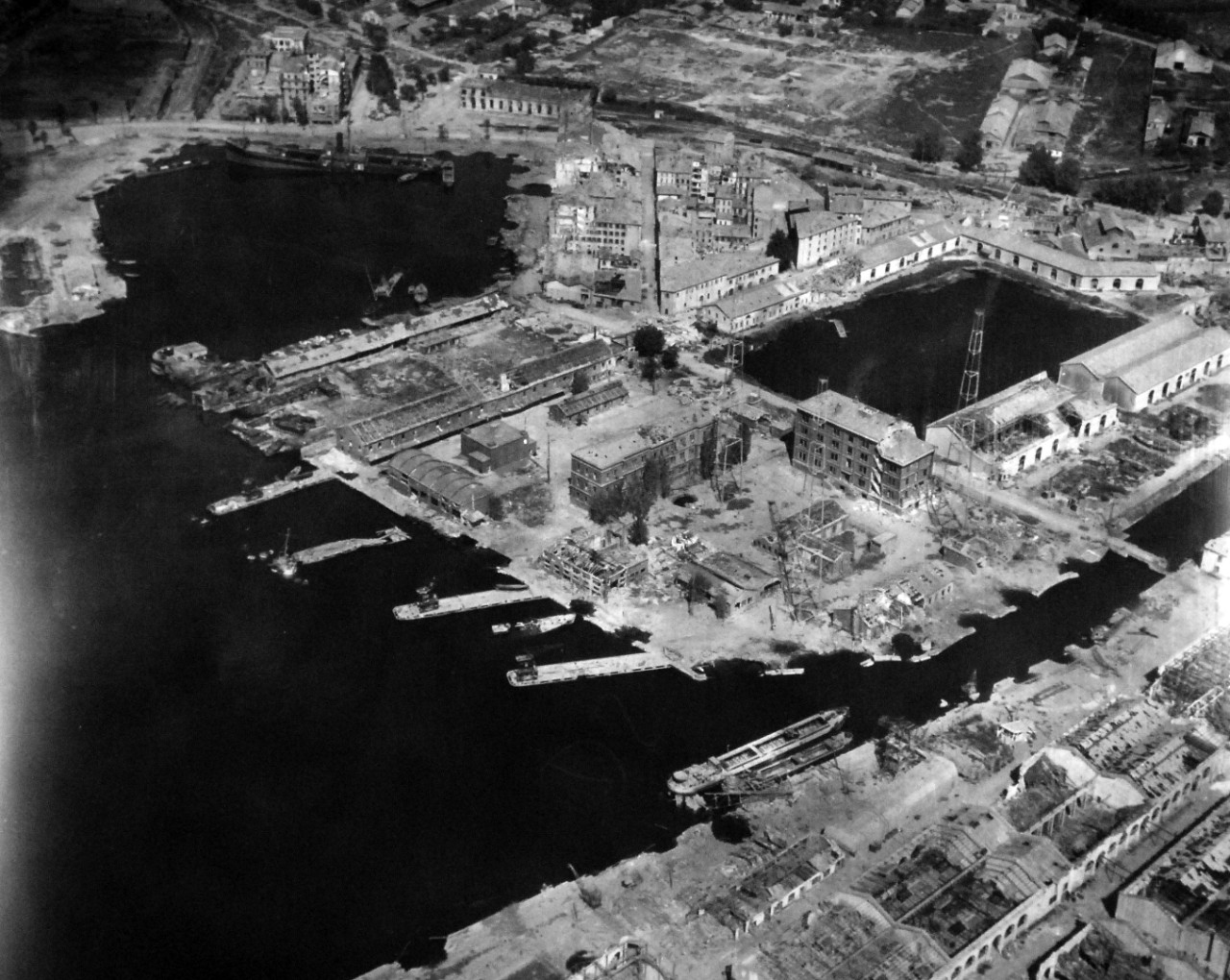 80-G-364001:  Invasion of Southern France, Toulon, August 1944.   Aerial view of the destruction to the harbor and installations at Toulon, France.  Taken by crew of USS Catoctin   (AGC 5).  Photograph received on 2 April 1946.   Official U.S. Navy Photograph, now in the collections of the National Archives.  (2014/7/10).