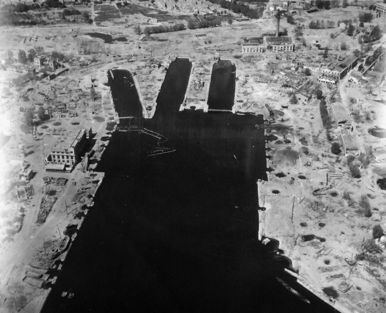 80-G-364006:  Invasion of Southern France, Toulon, August 1944.   Aerial view of the destruction to the harbor and installations at Toulon, France.  Taken by crew of USS Catoctin   (AGC 5).  Photograph received on 2 April 1946.   Official U.S. Navy Photograph, now in the collections of the National Archives.  (2014/7/10).