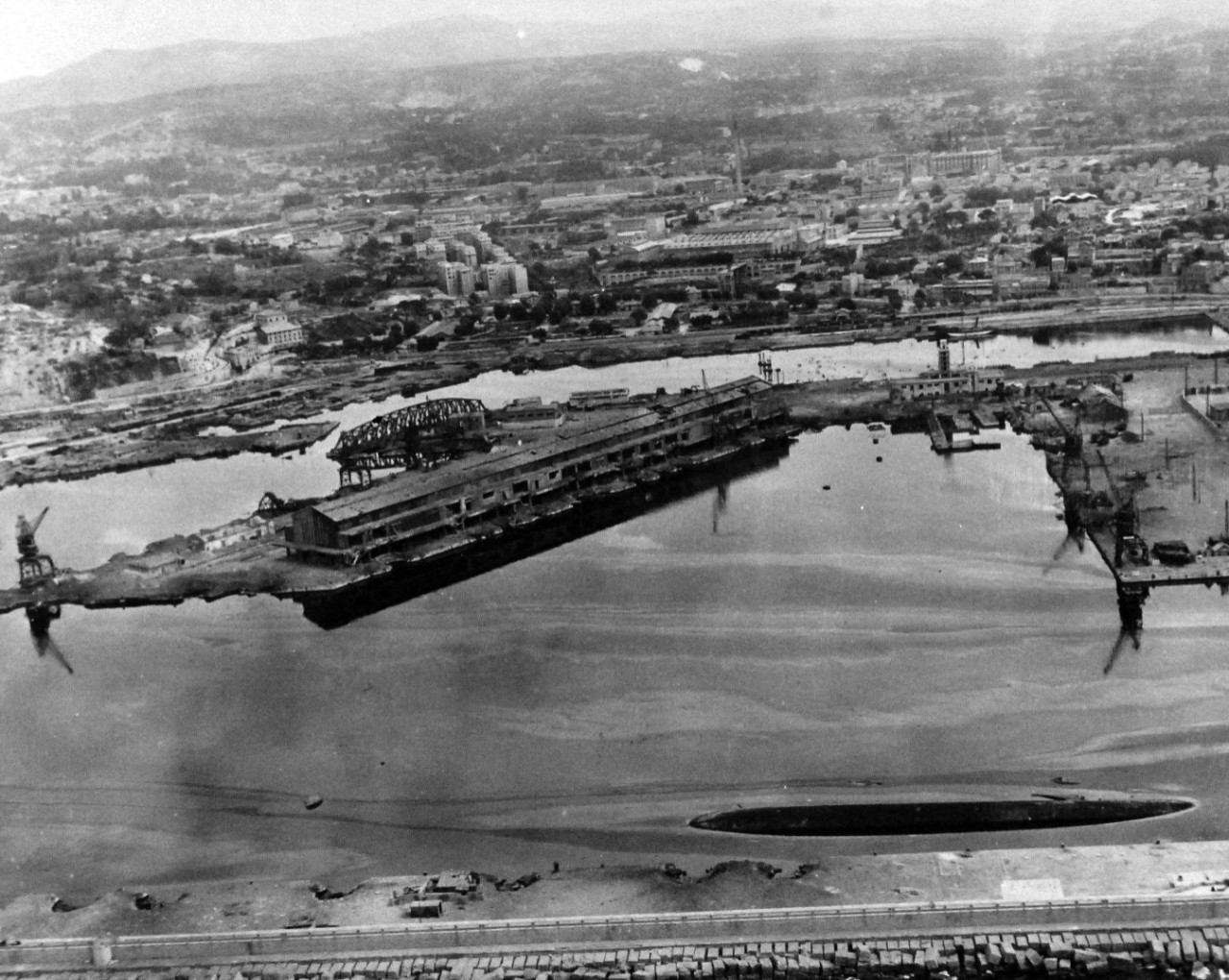 80-G-364014:  Invasion of Southern France, Toulon, August 1944.   Aerial view of the destruction to the harbor and installations at Toulon, France.  Taken by crew of USS Catoctin   (AGC 5).  Photograph received on 2 April 1946.   Official U.S. Navy Photograph, now in the collections of the National Archives.  (2014/7/10).