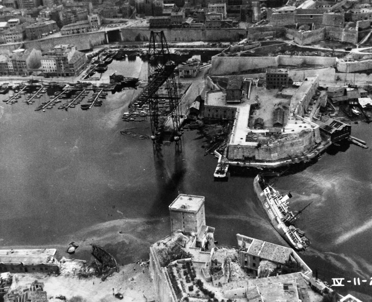80-G-364029:  Invasion of Southern France, Toulon, August 1944.   Aerial view of the destruction to the harbor and installations at Toulon, France.   Note SS Cap Corse to the mid right at the .   Taken by crew of USS Catoctin (AGC-5).  Photograph received on 2 April 1946.   Official U.S. Navy Photograph, now in the collections of the National Archives.  (2014/7/10).