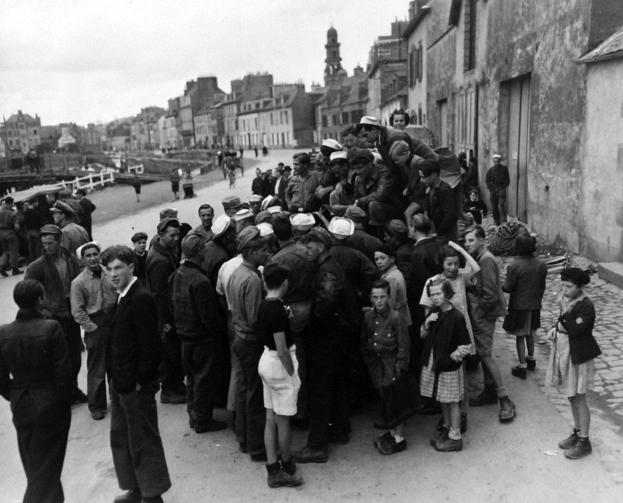 80-G-247090:  Invasion of France, Landerneau, August-September 1944.   Mail call for members of small boat crews at Landerneau, France, photograph received September 1944.   Official U.S. Navy Photograph, now in the collection of the National Archives.  (2014/3/12). 