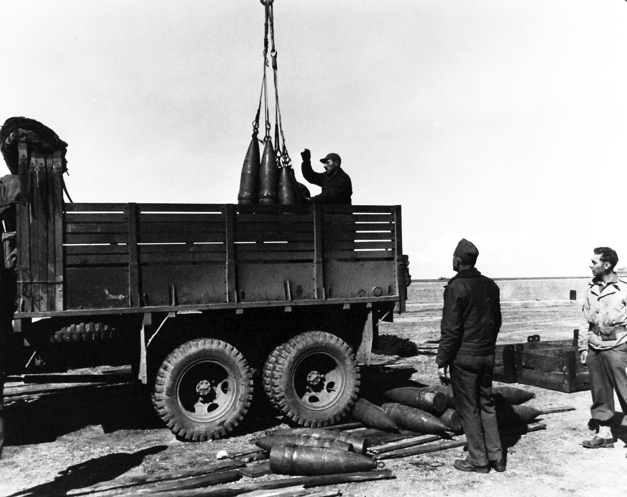 80-G-247140:   Invasion of France, Roscoff, August-September 1944.    US Navy Seabees loading ammunition at Roscoff, France, for battle of Brest.   Note 155MM Shells.    Official U.S. Navy Photograph, now in the collections of the National Archives.   (2014/3/12).  