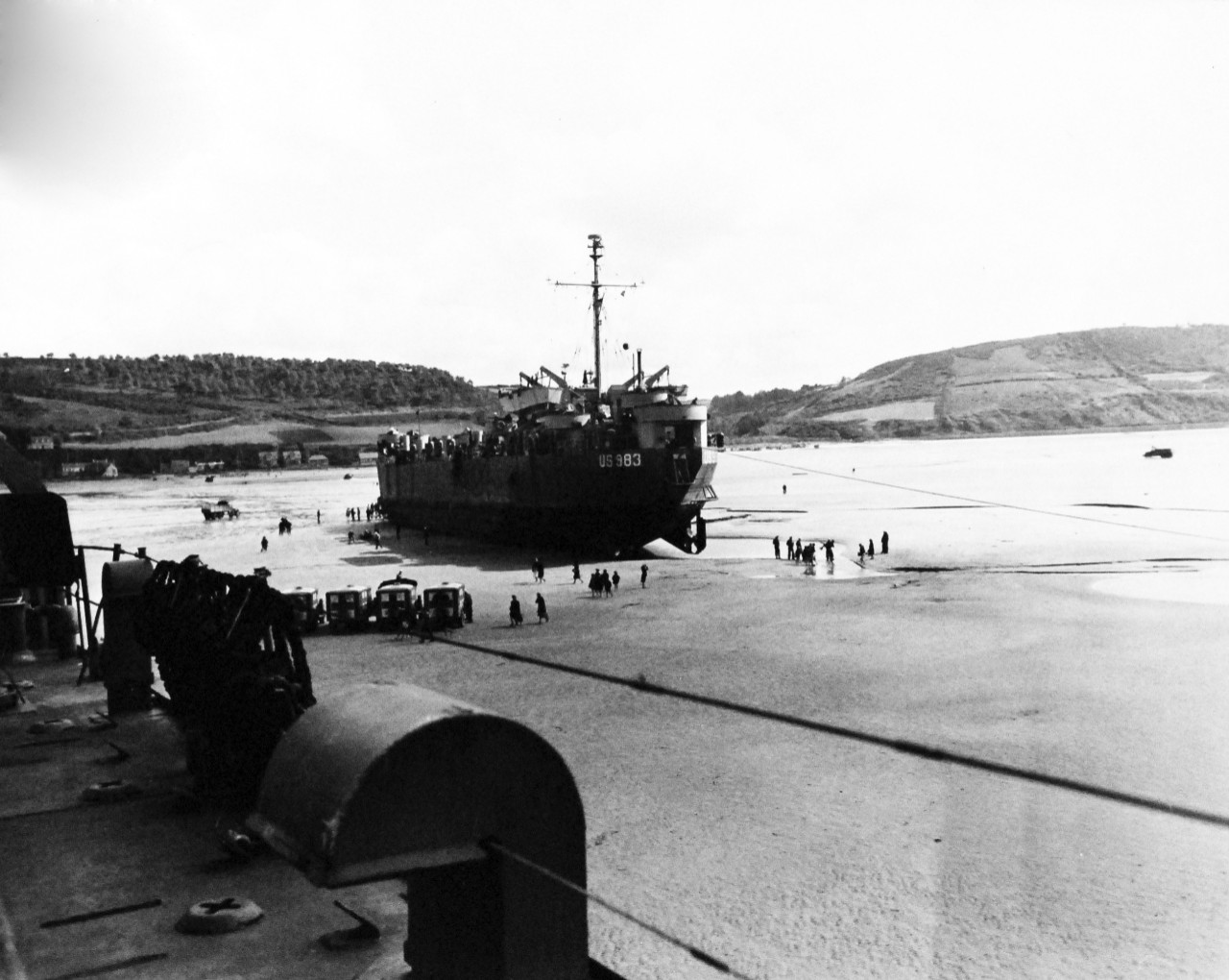 80-G-247145:   Invasion of France, August-September 1944.   USS LST-983, unloading cargo on the beach at Saint Michel-en-Greve, France, September 1944.  Official U.S. Navy Photograph, now in the collections of the National Archives.   (2014/3/12).  