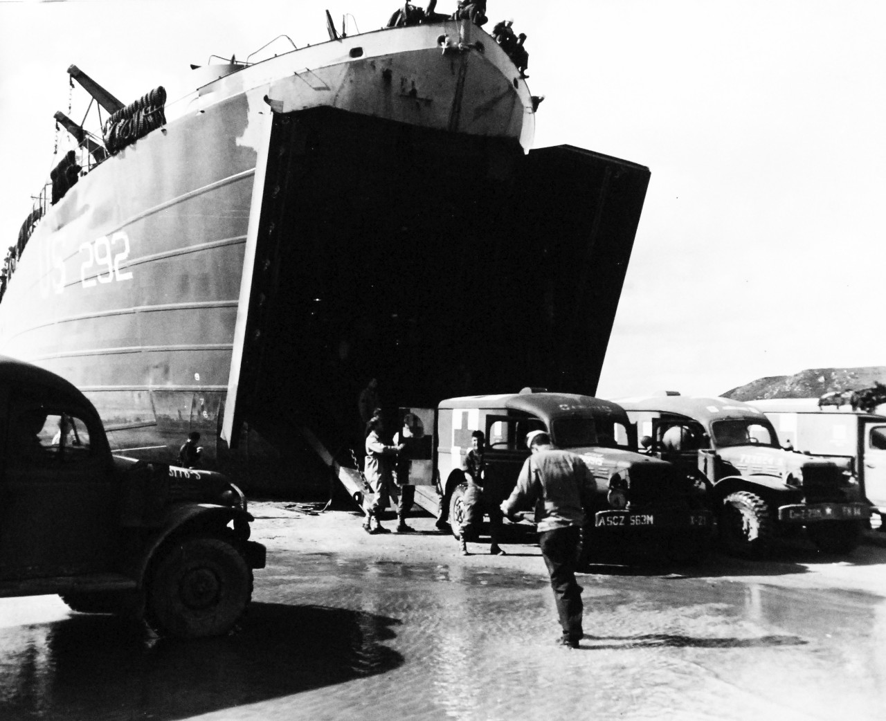 80-G-247147:   Invasion of France, August-September 1944.   After having discharged cargo on beach at St. Michel en Graves, France, war casualties are brought on board LSTs from ambulance.  Shown is USS LST 292, photograph received September 1944.   Official U.S. Navy Photograph, now in the collections of the National Archives.   (2014/3/12).  