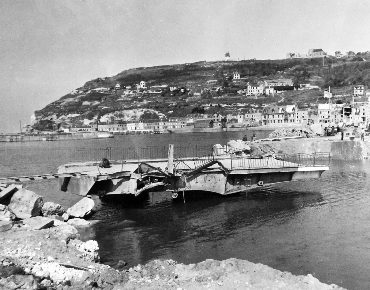 80-G-257270:  Invasion of France, Fecamp, August-September 1944.  The harbor of Fecamp, France, channel port, showing unsuccessful attempts by Germans to block the entrance before it was liberated by the Allies, 22 September 1944.  Official U.S. Navy Photograph, now in the collection of the National Archives.    (2014/10/28). 