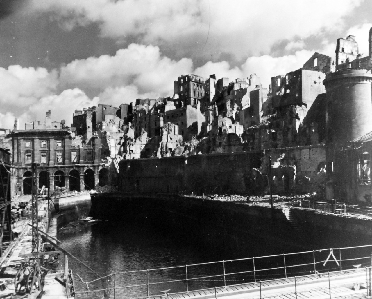 80-G-257410:   Invasion of Southern France, Brest, August-September 1944.   Allied Naval gunfire and aerial bombing of Brest, France, during the battle for the liberation of the city resulted in this devastation and wreckage.  Shown is the small section of the inner harbor, one of the dry docks where Germans once repaired their warships, 5 October 1944.  Official U.S. Navy Photograph, now in the collections of the National Archives.   (2014/10/28).