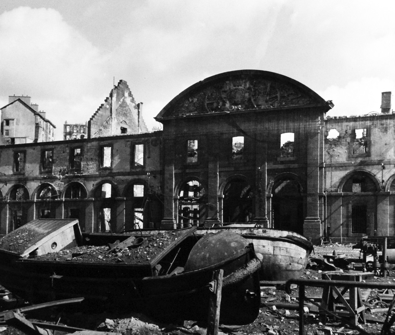 80-G-257462:  Invasion of Southern France, Brest, August-September 1944.   Allied Naval gunfire and serial bombing of Brest, France, during the battle for the liberation of the city, resulted in this devastation and wreckage.   Shown is the shell of the old French arsenal, around it are wrecked boats and other debris, 27 September 1944.  Official U.S. Navy Photograph, now in the collections of the National Archives.   (2014/10/28).