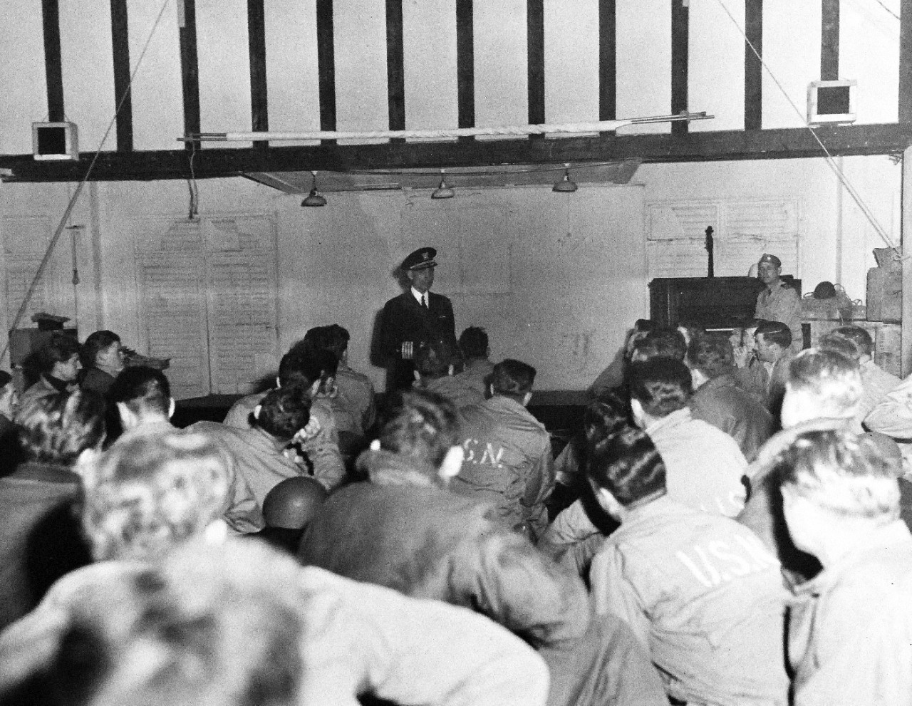 80-G-285139:  Normandy Invasion, Crossing the Channel, June 1944.   Captain Clark briefs a group of Navy men on board ship preparatory to invasion of France.  Photograph released November 7, 1944.  U.S. Navy photograph, now in the collections of the National Archives.  (2016/03/15).