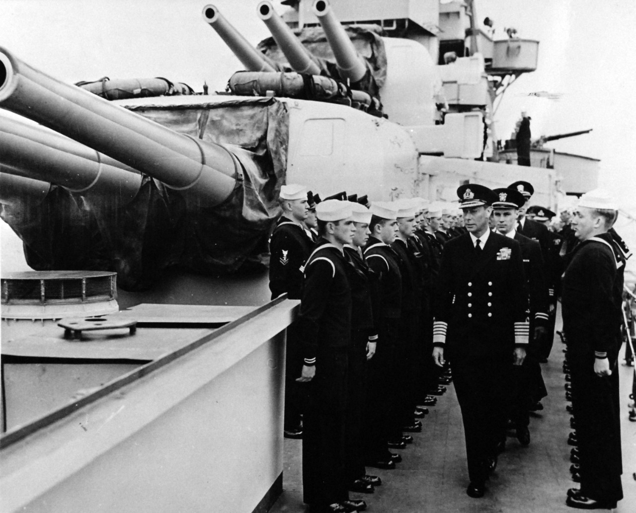 80-G-45710:   Normandy Invasion, June 1944.   King George VI of Great Britian visits U.S. Navy fighting ships at an English base.  U.S. Navy bluejackets stand rigidly at attention.  Photograph released on 10 June 1944.   Official U.S. Navy Photograph, now in the collections of the National Archives.  (2014/9/9).  