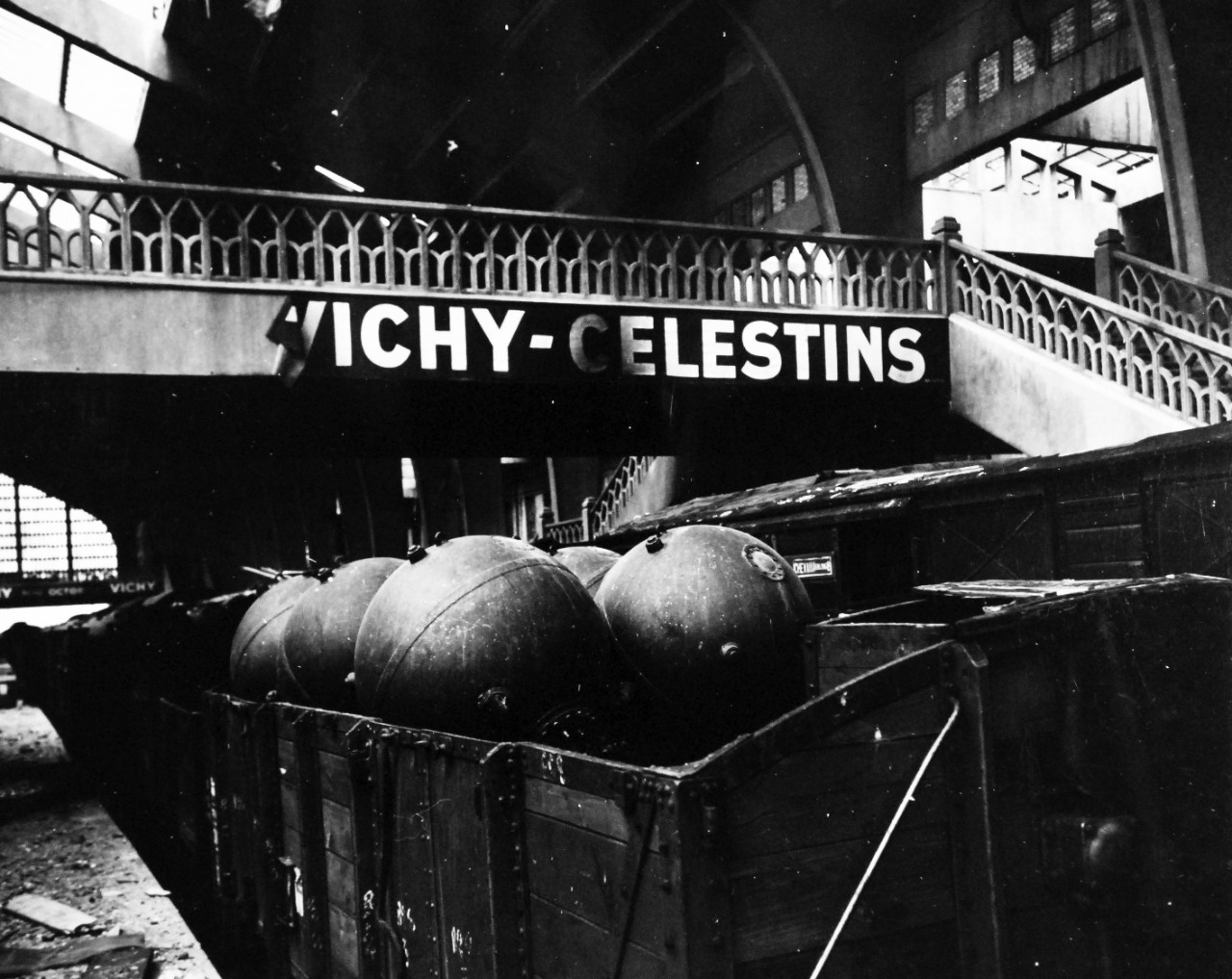 80-G-255944:   Normandy Invasion, Cherbourg, France, July 1944.    Carload of German mines salvaged by U.S. and British mine disposal men in railroad station at Cherbourg, France.  Note the Vichy-Celestins sign.  Photograph received October 28, 1944.  Official U.S. Navy Photograph, now in the collections of the National Archives.   (2014/11/05). 