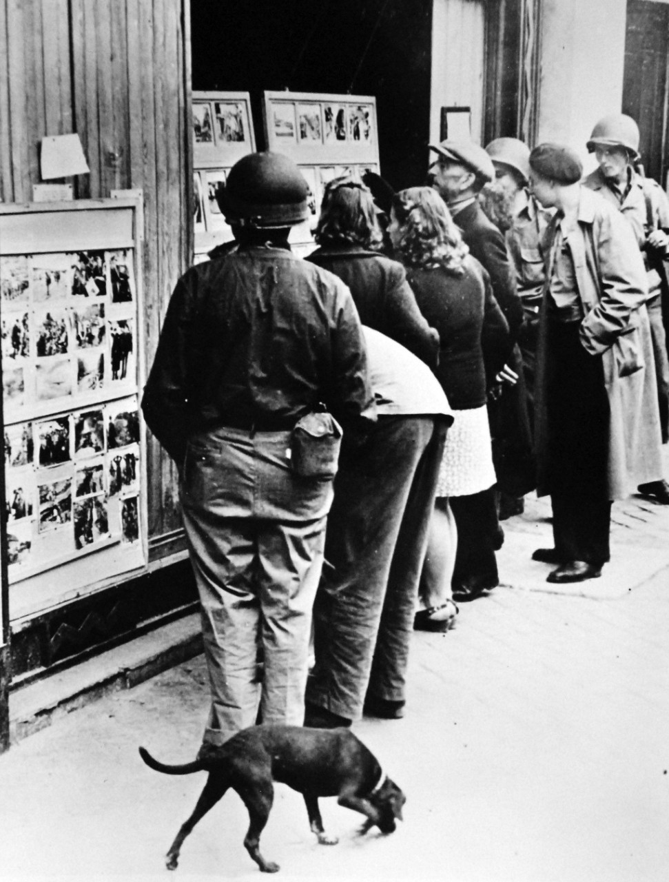Lot 11611-8:  Liberation of France, Cherbourg, France, Summer 1944.   Crowd gathers before Allied picture display in Cherbourg crowd around a picture display in the windows of the Psychological Warfare Division of the Allied Expeditionary Force.  Cut off from the world during the four years of Nazi occupation, civilians from the Normandy beach village to the great port city were found hungry for news and pictures.   Photographed by U.S. Army Signal Corps.  Office of War Information Photograph.  Courtesy of the Library of Congress.   (2016/02/25)