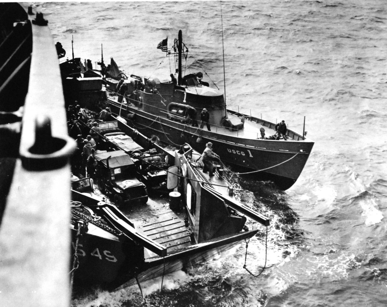 26-G-06-10-44-1:  Normandy Invasion, June 1944.  Sub Busters in Invasion Role.  The U.S. Coast Guard’s famous 83 footers, sub-busters in the Battle of the Atlantic, and to their laurels as rescue craft in the D-Day sweep across the English Channel to the French Coast.  These swift, little, intrepid craft are the Coast Guard boats that have been mentioned over and over again in radio and news dispatches for their gallant rescue role during the initial smash on France, June 1944.  Official U.S. Coast Guard Photograph, now in the collections of the National Archives.   (2015/5/19).  