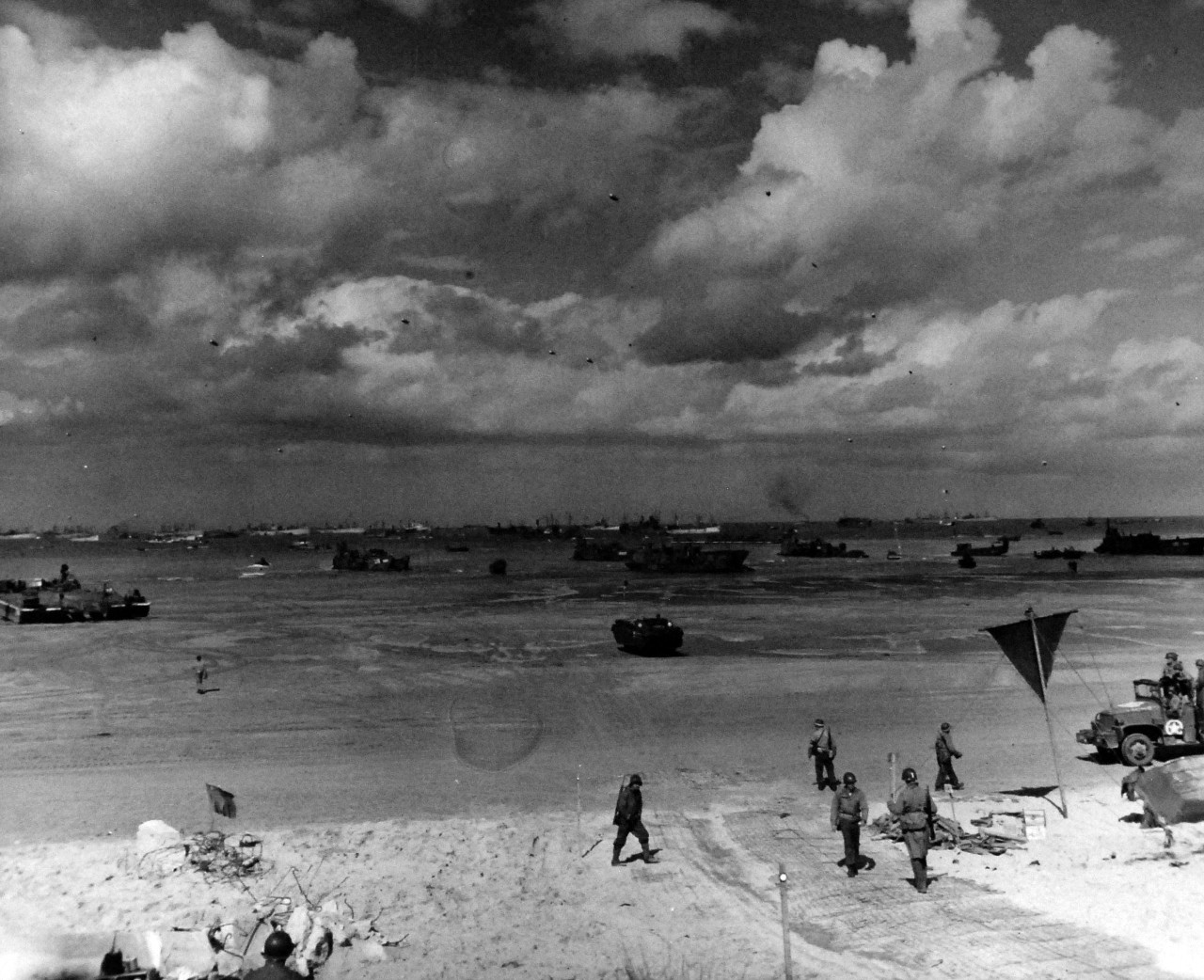 80-G-59432:   Normandy Invasion, June 1944.   Allies use every available method and type of landing craft to unload supplies at Normandy, France, during the Allied invasion of Europe, released 10 June 1944.  Official U.S. Navy Photograph, now in the collections of the National Archives.    (2014/3/12).   