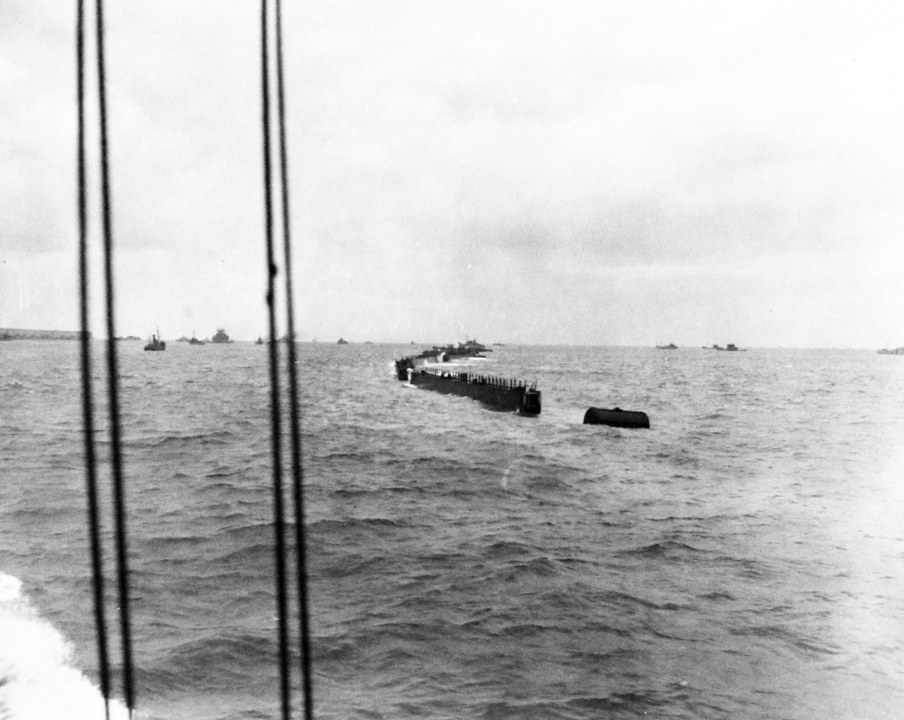 80-G-285195:  Normandy Invasion, Mulberries, June 1944.   “Bombardons” wave-repellent units forming part of the “Mulberry,” the man-made harbor off Normandy coast of France.  Photograph released November 7, 1944.  Official U.S. Navy photograph, now in the collections of the National Archives.  (2016/03/15).