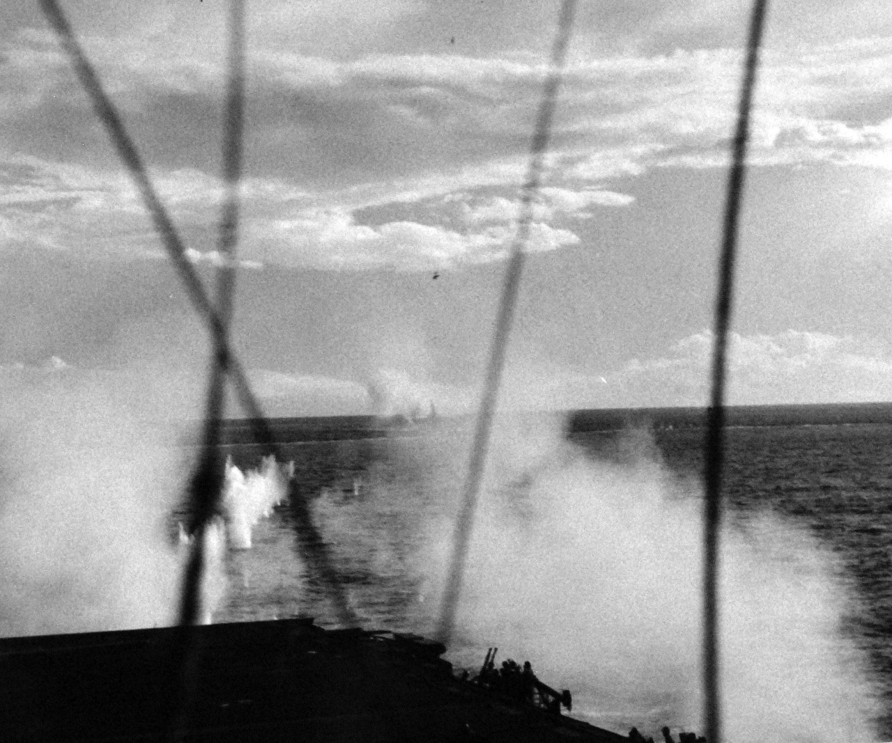 80-G-270624:  USS Suwannee (CVE-27), October 25, 1944.  Anti-Aircraft Fire at a Japanese “Zero” during its attempt to make a suicide dive into the flight deck of USS Suwannee (CVE-27) at Leyte, Philippines, taken from USS Sangamon (CVE-26).  Official U.S. Navy photograph, now in the collections of the National Archives.  