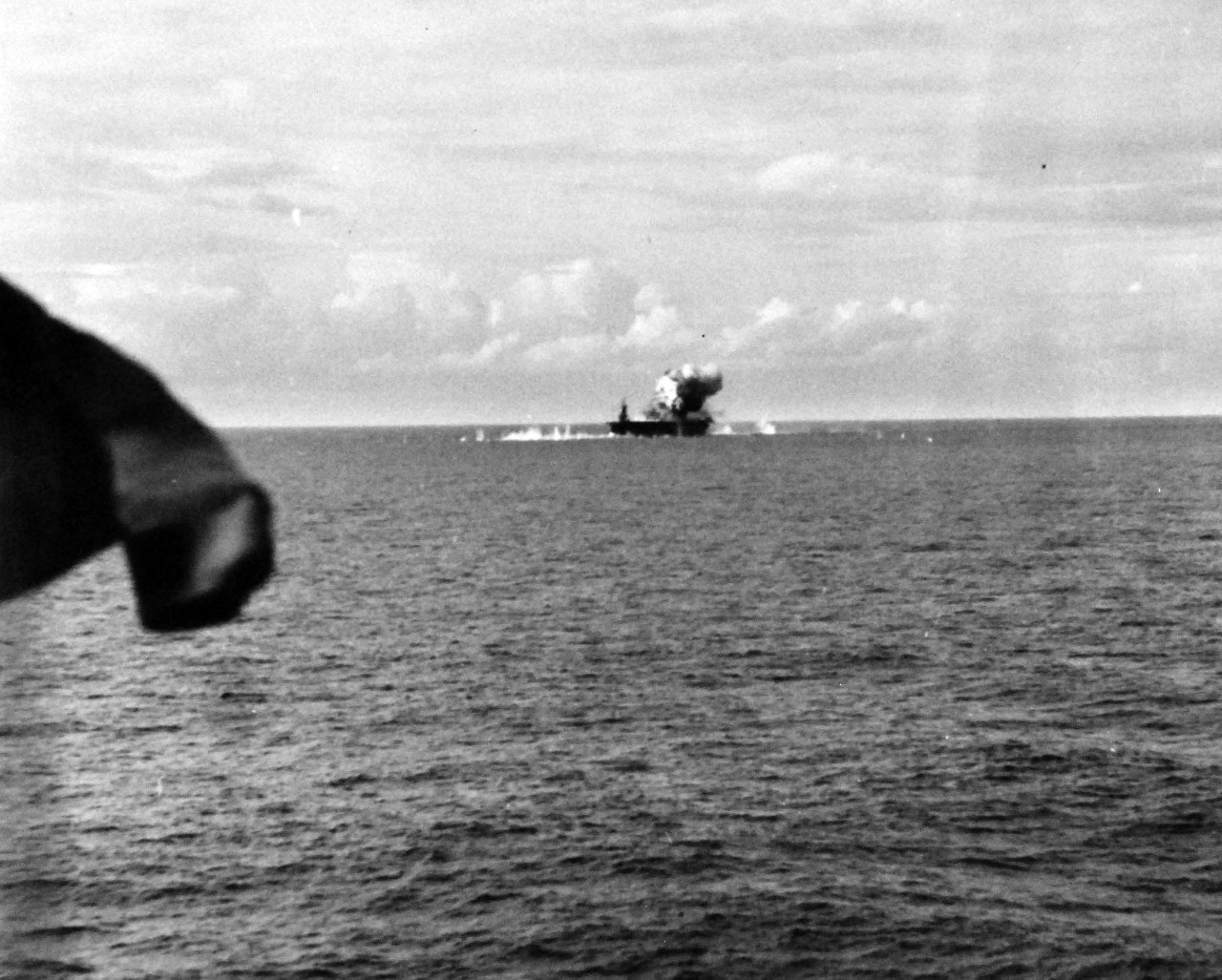 80-G-270667:  USS Santee (CVE-29), October 25, 1944.  Japanese suicide plane attacking USS Santee (CVE-29), hitting after end of flight deck off Leyte Gulf, Philippines, as seen from USS Suwannee (CVL-27).  Official U.S. Navy photograph, now in the collections of the National Archives.  