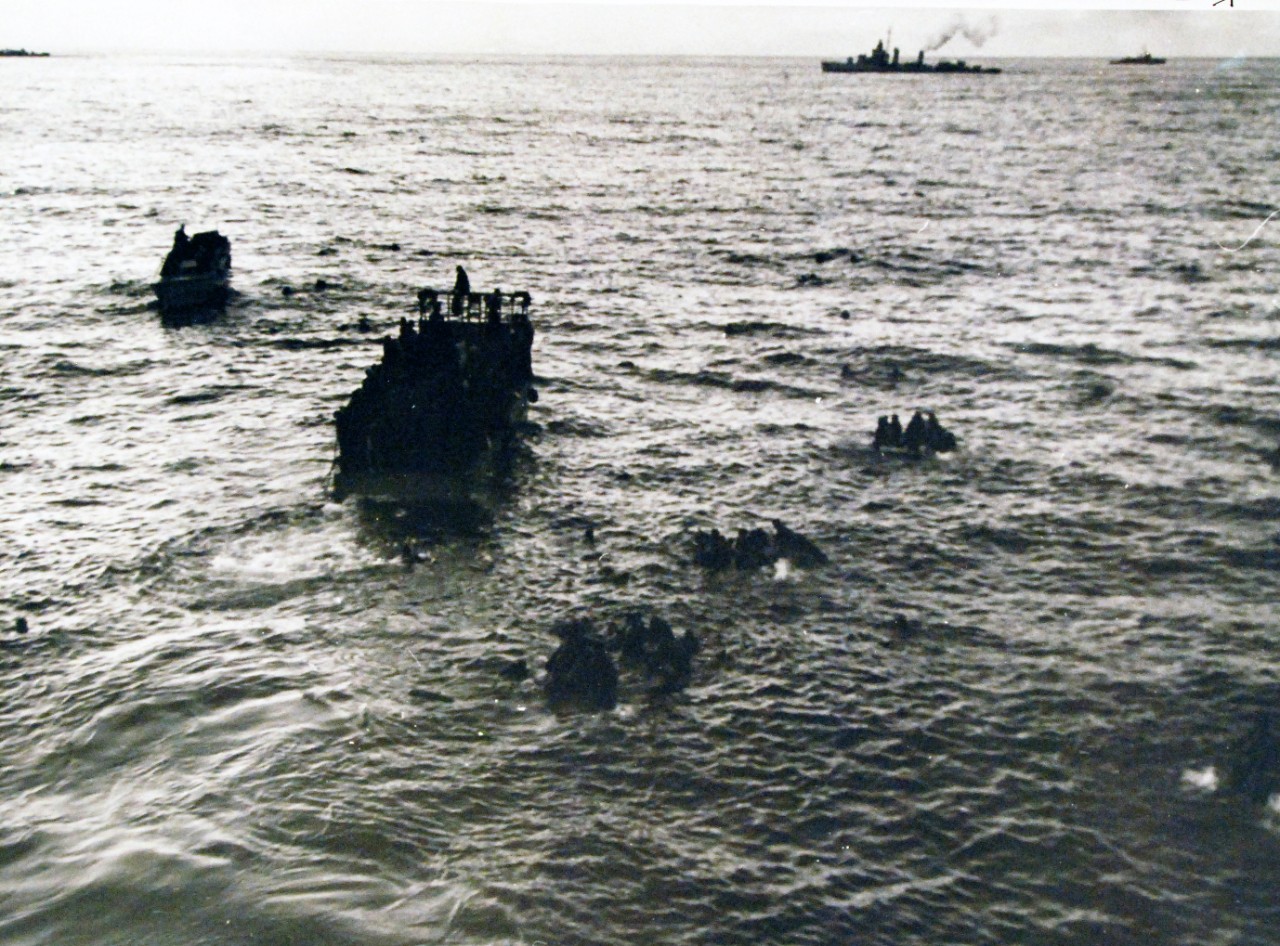 <p>19-LCM-North Africa-3: Naval Battle of Casablanca, November 8-16, 1942. Fedala, French Morocco (Casablanca area). Kept afloat by life jackets and rafts, survivors of three torpedoed U.S. transports are picked up by landing barges and boats from other U.S. ships lying off Fedala. The transports were sent to the bottom by many enemy submarines during the operations directed at Casablanca, about 15 miles south Fedala, during the forepart of November 1942 (Operation Torch). Photograph released 3 December 1942.&nbsp;</p>
