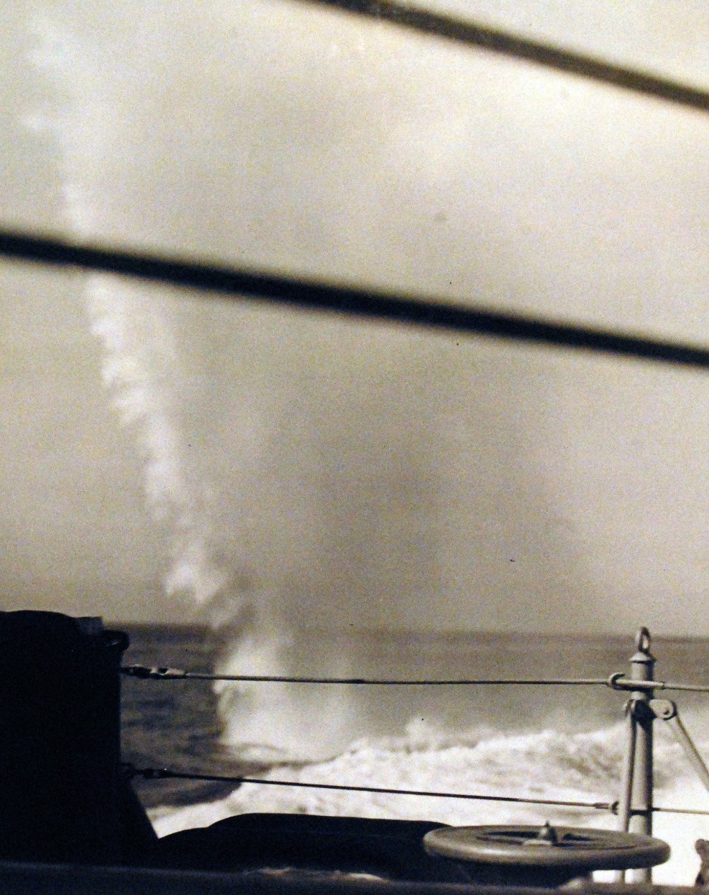 <p>80-G-38826: Naval Battle of Casablanca, 8-16 November 1942. Shells from French battleship Jean Bart land in the water near USS Massachusetts (BB 59). Shown is a near miss of 15” shell just off the fantail.&nbsp;</p>
