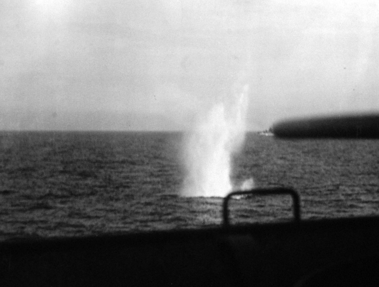 <p>80-G-38827: Naval Battle of Casablanca, 8-16 November 1942. Shells from French battleship Jean Bart land in the water near USS Massachusetts (BB 59). Shown is a near miss of 15” shell just off the fantail.&nbsp;</p>
