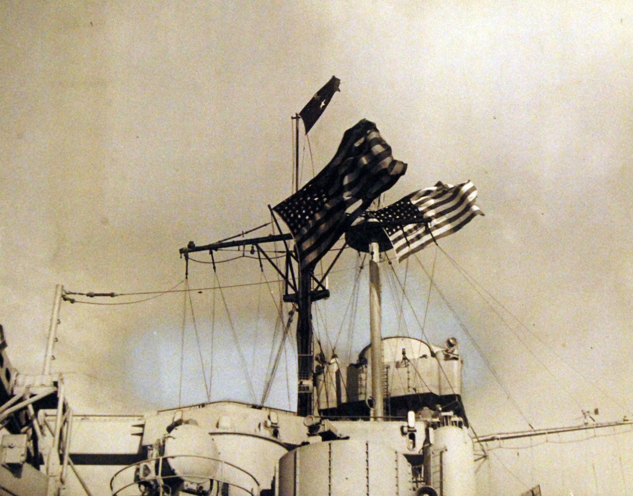 <p>80-G-38833: Naval Battle of Casablanca, 8-16 November 1942. Colors flying on the flag bridge of USS Massachusetts (BB 59) during the battle. Note the shell hole in the battle flag and radars airbrushed out.&nbsp;</p>
