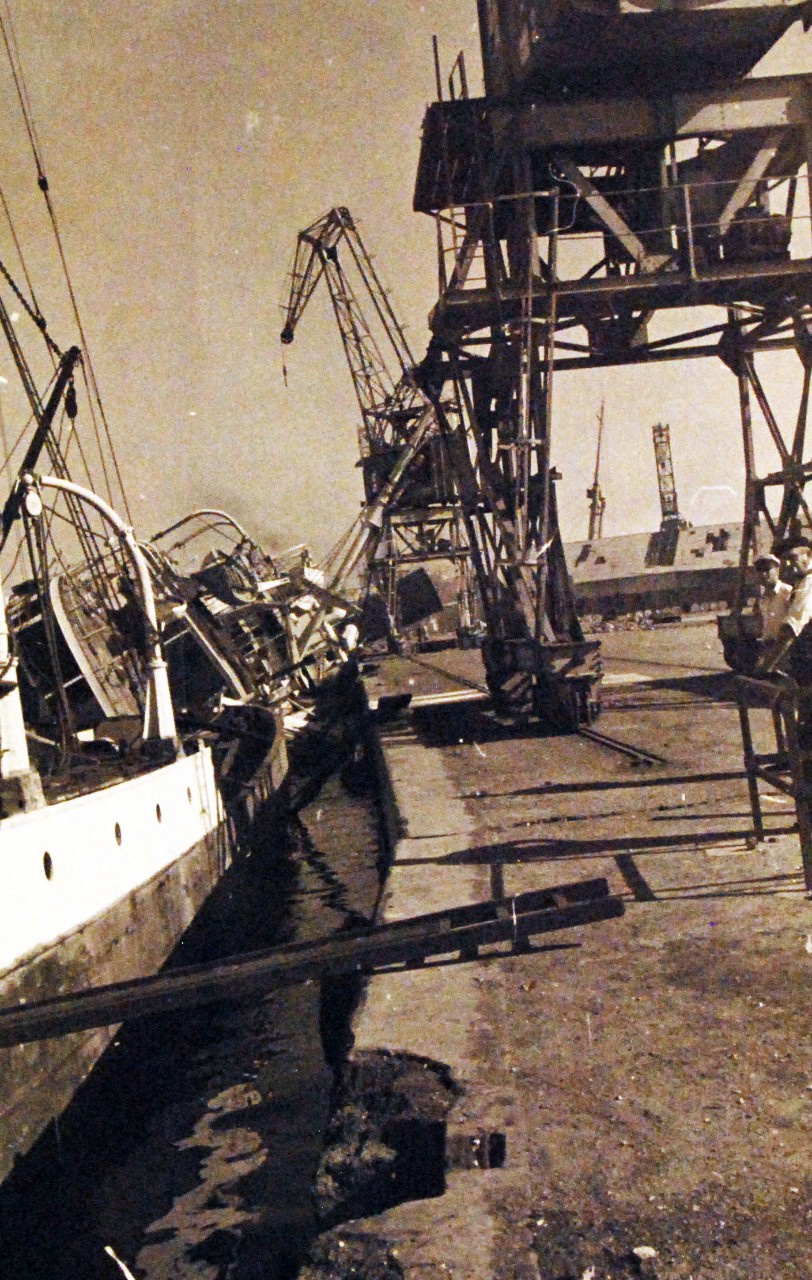 <p>80-G-19921: Operation Torch, November 1942. Damaged ships at Casablanca Harbor, Morocco, during the first days of the U.S. campaign in North Africa. French ship SS Porthos is shown damaged.&nbsp;</p>
