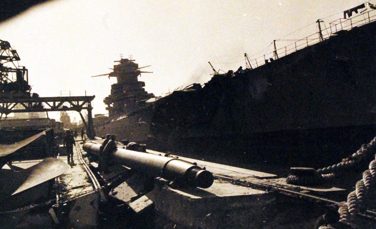 <p>80-G-19924: Operation Torch, November 1942. . Damaged ships at Casablanca Harbor, Morocco, during the first days of the U.S. campaign in North Africa. French battleship, Jean Bart, is shown damaged. Official U.S. Navy Photograph, now in the collections of the National Archives. (2015/4/7).</p>
